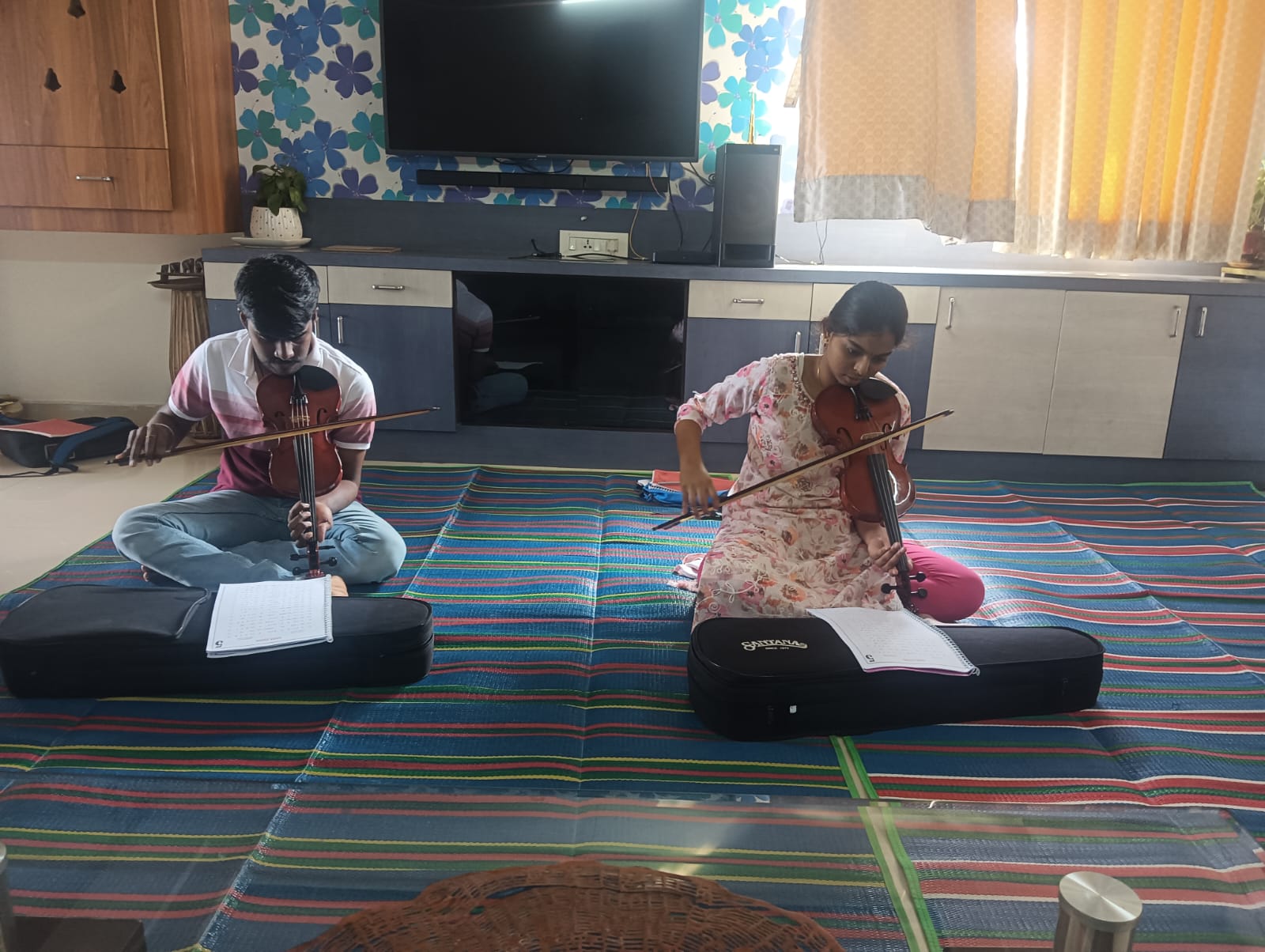 Students practicing violin during class